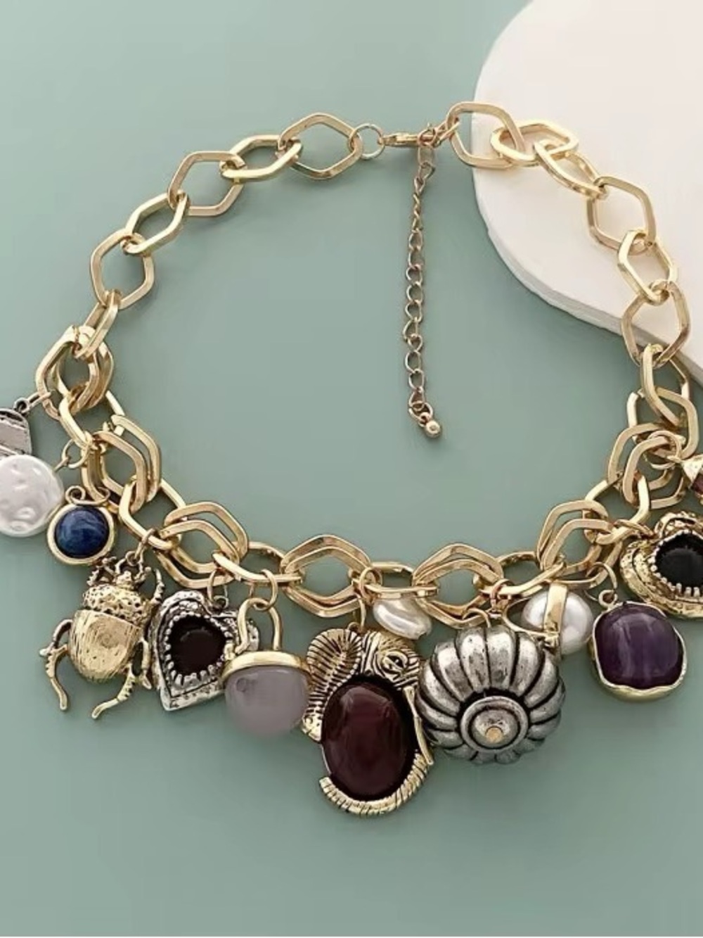 Gold Charm Statement Necklace with Multicolor Gem Accents